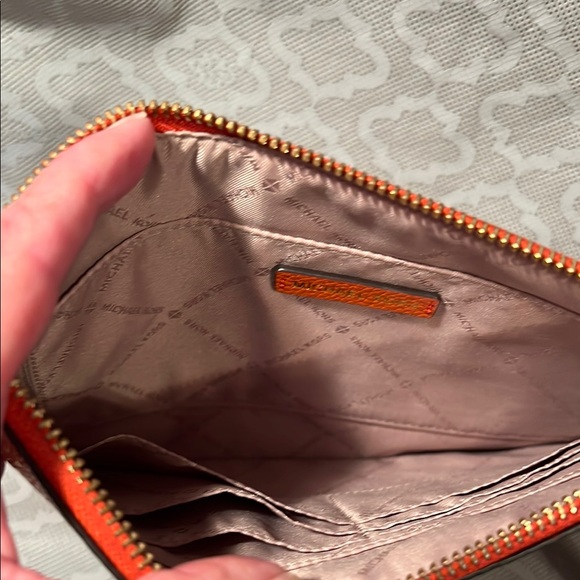 Michael Kors Orange Clutch with Intricate Embossed Design - Picture 8 of 11